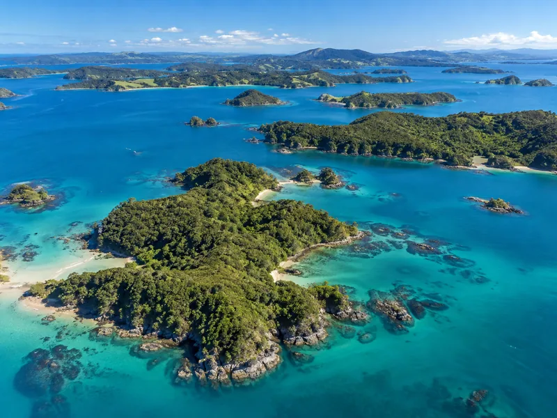 Turquoise water and forested islands in the Bay of Islands